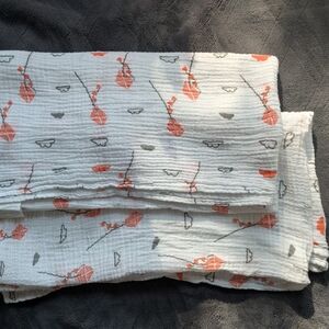 White and Orange Patterned Blanket